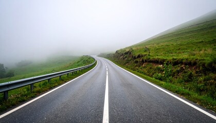 Winding road through misty mountains