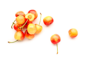Sweet yellow cherries on white background