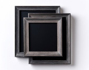 Three stacked, dark gray wooden picture frames against a white background
