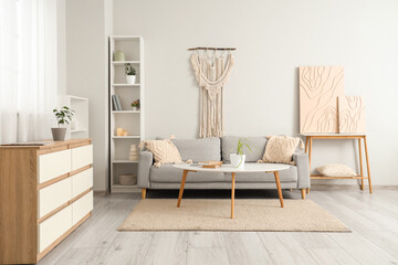 Obraz premium Stylish sofa with table in living room