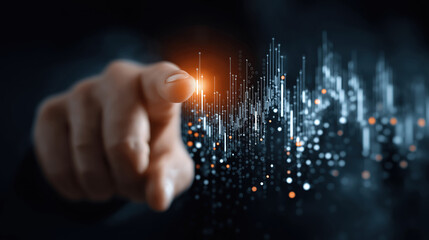 Hand pointing to graph showing business data analysis on a high tech digital interface