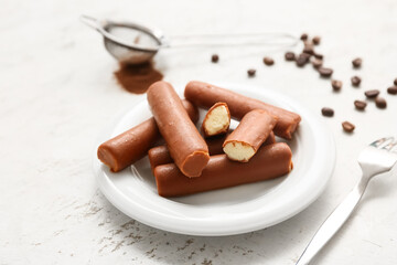 Delicious curd bars with vanilla and coffee beans on white grunge background