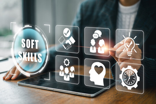Business professional using digital interface to highlight essential soft skills for effective communication and teamwork.