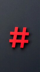 Obraz premium Red hashtag symbol on dark background