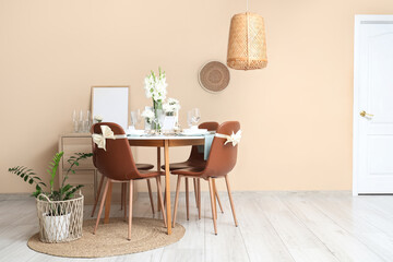 Interior of room with served dining table and white Gladiolus flowers
