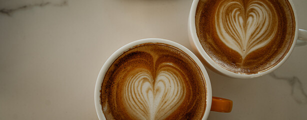 Cups of coffee decorated with a heart