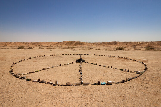 Rocks and Found Objects Arranged into Peace Sign in Slab City Desert
