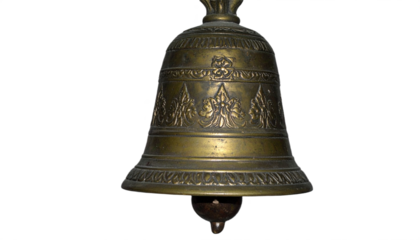 Antique ornate brass bell with intricate cultural patterns evoking tradition and spiritual resonance