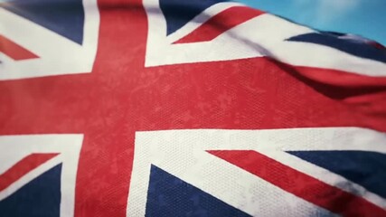 Close-up of the Union Jack flag waving in the wind, crisp fabric texture, shot against a bright blue sky with soft white clouds - Powered by Adobe