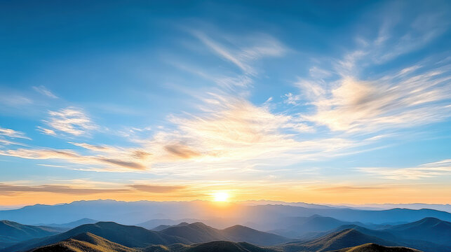 Breathtaking sunset over rolling hills, with vibrant clouds and clear blue sky