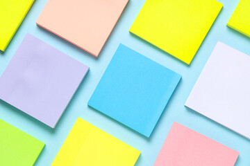 Many colorful sticky notes on blue background