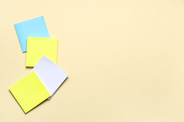 Blank sticky notes on beige background