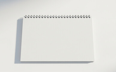 Blank Notepad Mockup With Spiral Top On White Surface