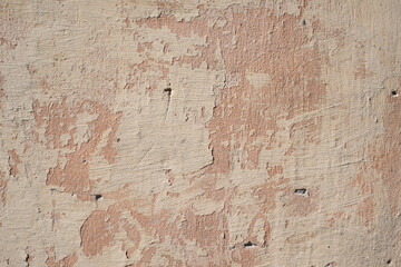 High resolution image of heavily deteriorated exposed concrete wall with cracks
