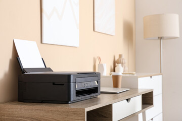 Modern printer on table in stylish home office, closeup