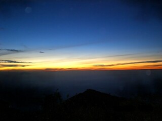 Beautiful sunrise view above mountain horizon with clear sky, perfect for travel, nature, and adventure themes in tourism or outdoor lifestyle projects