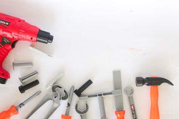 Toy craftsman tools on white background