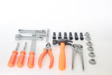 Toy craftsman tools on white background