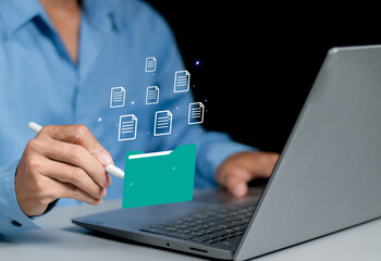 Document management system, DMS, company employees manage folders via laptop, access document information with document management software, search for business information, manage corporate files.