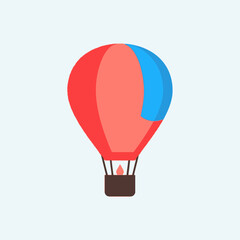 Obraz premium A colorful hot air balloon floats against a light blue sky.