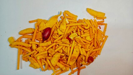 World food day, snacks Day,Indian mix snack, deep fried salty dish - chivda made of flour, mixed with roasted nuts, pepper, pulses, spice and green peas. Bombay mix