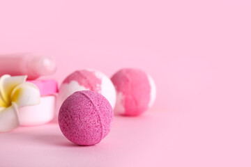 Bath bombs on pink background, closeup