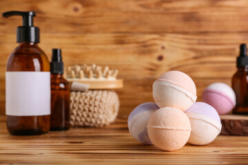 Bath bombs on wooden table, closeup