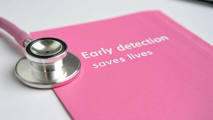 A stethoscope rests on a pink document that reads "Early detection saves lives," emphasizing the importance of early medical diagnosis.