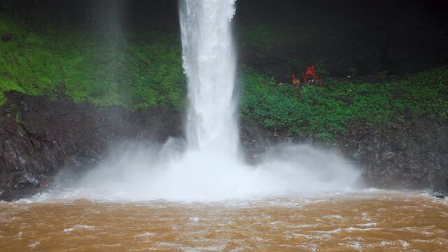 4K Slow motion shot of Devkund waterfall during the monsoon season at Raigad district in Maharashtra, India. Scenic view of the waterfall during the rainfall. Natural waterfall in Western Ghats.