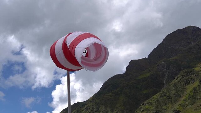 Red and White Wind Sock in Mountains