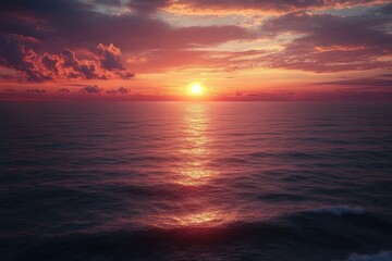 Obraz premium Serene ocean scene at sunset with calm waves reflecting golden sunlight under a colorful sky with scattered clouds