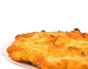 Closeup of a freshly fried golden schnitzel with a crispy breadcrumb coating.