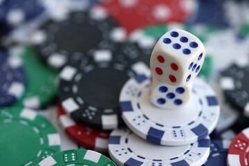 Dice game on the poker table in the casino. A successful combination of dice brought a lot of winning chips
