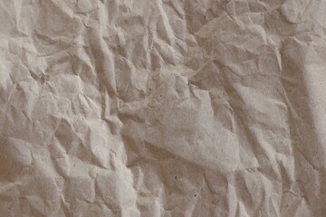 Brown crumpled recycled paper texture background. Kraft Paper