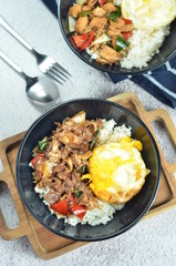 Ricebowl with beef teriyaki and egg served in bowl on the table