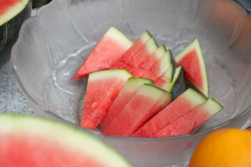 Freshly sliced watermelon arranged in a clear bowl