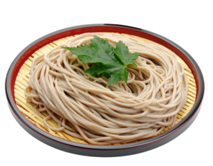 Chilled Japanese Zaru Soba noodles served on a bamboo mat with a green maple leaf garnish.