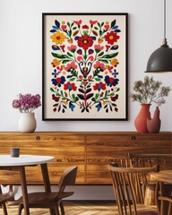 A framed poster with an embroidered floral pattern hanging on the wall, a symmetrical composition, a retro style, a wood grain sideboard and chairs in front of it