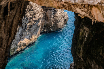 Fototapeta premium Grotta del Turco is so called, as in the ninth century the ships of the Saracens took refuge in the crevices of this strategic promontory, to attack ships in transit and plunder them.