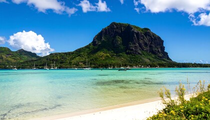 Tranquil tropical bay with a dramatic cliff face.