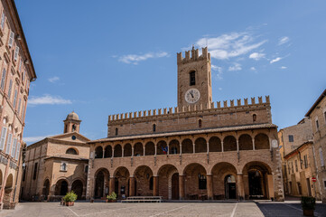 Fototapeta premium Offida. Town Hall. Built between the 13th and 14th centuries (central crenellated tower). The façade is preceded by a 7-arched portico with an elegant 14-arched loggia raised in the 15th century.