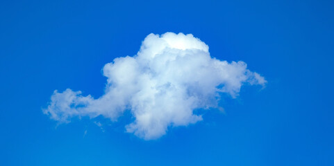 A small round cloud moves across the clear blue sky. The path of the rain is from left to right.. White hat cloud dreaming in your imagination