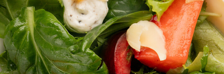 Crisp greens embrace radiant watermelon and creamy dressing, evoking summer solstice feasts and...