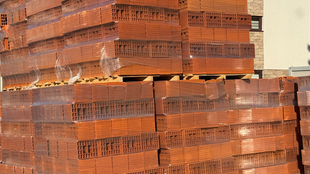 Stacks of terracotta bricks whisper tales of industrial metamorphosis, echoing Bricklayer Appreciation Day and sustainable architecture dreams
