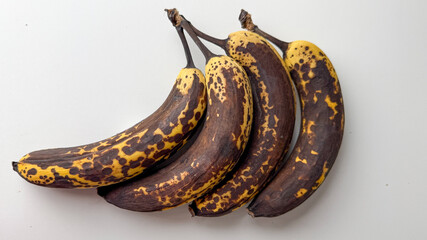 Four overripe bananas, speckled with mystic decay, embody the spirit of Zero Waste Week and National Banana Bread Day