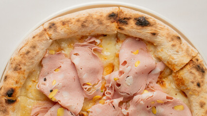 Savory mortadella pizza whispers umami symphony, perfect for La Festa della Pizza or National Cheese Pizza Day celebrations