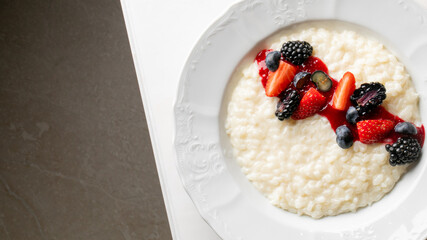 Creamy rice pudding crowned with a medley of vibrant berries, perfect for Lunar New Year feasts and Hygge celebrations