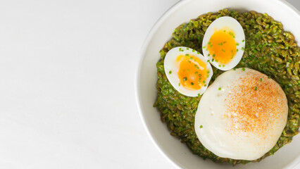 Herbaceous matcha-infused risotto cradles oozing soft-boiled eggs, perfect for Earth Day brunch or quirky fusion Piccolo Teatro evenings