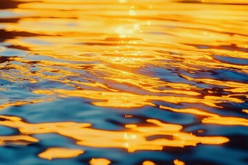 Close-up of water surface with golden sunlight reflections creating vibrant ripples and shimmering patterns