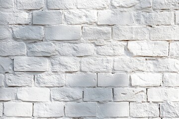 Close-up of a white painted brick wall with rough texture and visible mortar lines under natural light